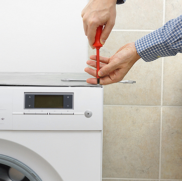 A man performing Appliance Repair in Springfield IL for a washing machine