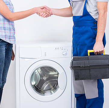 Photo of an appliance repair technician and a homeowner shaking hands after Chambers Services Inc.'s appliance repair is complete.