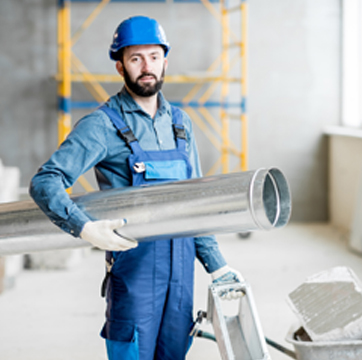 Air Conditioning Contractor in Bloomington IL carrying ventilation pipes