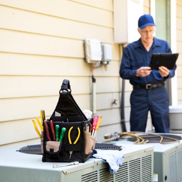 A technician services an AC unit after a homeowner calls Chambers Services, which offers AC Repair Near You