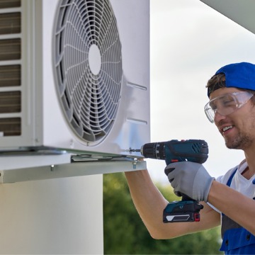 A man performing AC installation in Bloomington IL