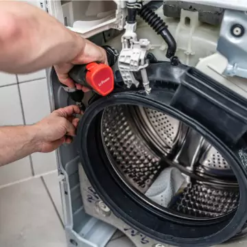 A broken drum of a washing machine requiring appliance repair from Chambers Services, Inc.