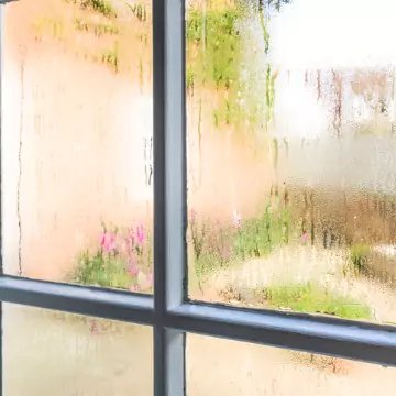 Condensation on window panes, signaling the need for proper home humidifiers and dehumidifiers installed by Chambers Services