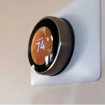 A Smart Thermostat set to a heat of 74 degrees, installed by the experts at Chambers Services